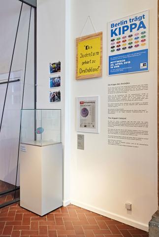 Exhibition room with wall texts about the kippah.