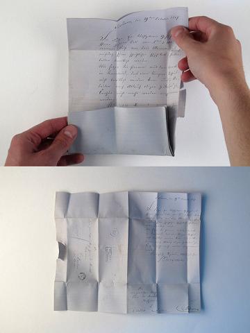 Two photos of the letter reconstruction, one almost, one fully unfolded