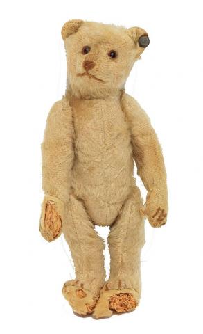 Light brown teddy bear from the Steiff company with the manufacturer’s trademark “button in the ear.”