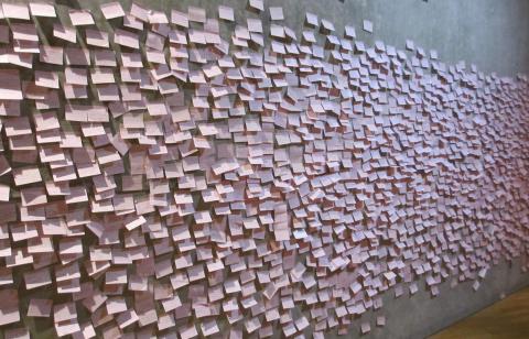 Wall full of pink sticky notes