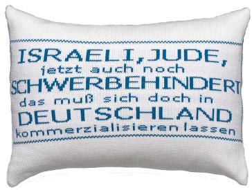 White pillow with blue script