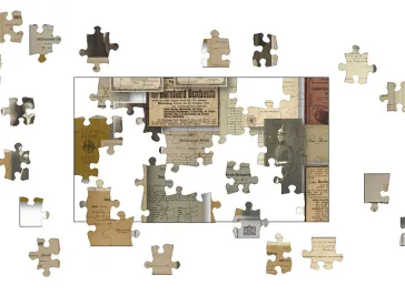 Ein noch nicht fertiggestelltes Puzzle, das verschiedene historische Dokumente als Motiv hat. 