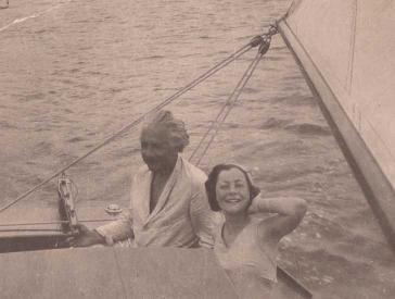 Black and white photograph of Albert Einstein and a young woman (Irene Salinger) on a sailboat.
