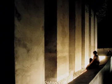 People sit in front of the stands in the Diaspora garden.