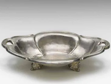 Bowl with two handles and feet, photographed diagonally from above