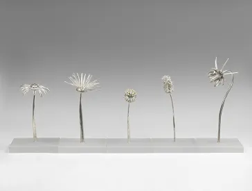 Five silver and gold spice boxes imitating wild flowers