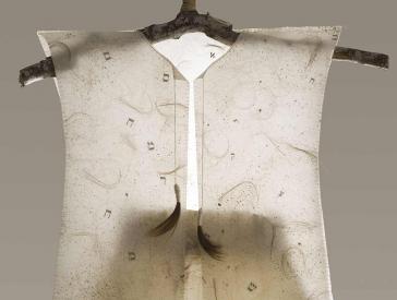 Paper dress with integrated human hair.