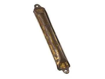 Elongated metal capsule, from which the golden paint has largely peeled off, holes at the top and bottom for fastening.