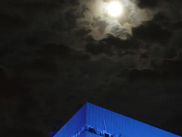 Exterior facade of the Liebeskind building and view of the night sky.