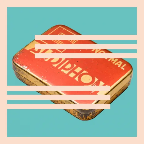 A tin can with the inscription Audiphon against a light blue background, with the S-shaped Schocken logo above it.