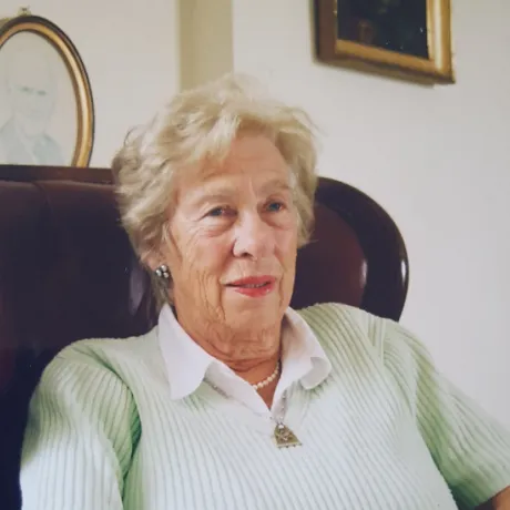 Portrait of an elderly woman in an armchair