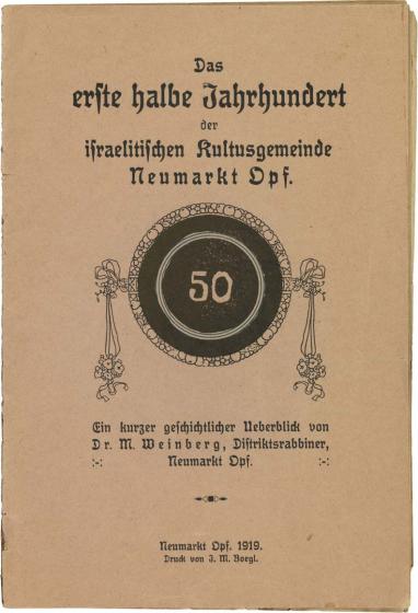 Titelseite einer gedruckten Broschüre mit der Jubiläumszahl „50“, umrahmt von Blumenblüten