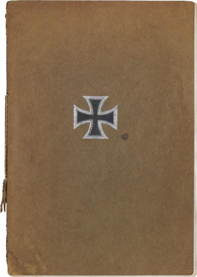 Memorial book with brown binding and Iron Cross