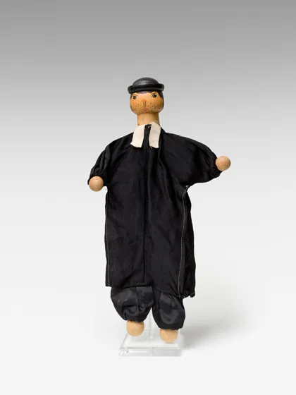  Hand puppet representing a priest.