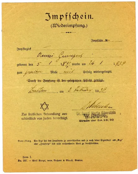 Vaccine certificate for Aenni Gumpert, printed form, filled out by hand, likewise with a government-imposed second name and a reference to the doctor’s treatment restrictions
