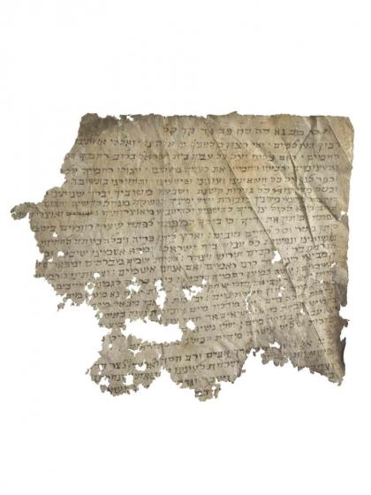 Old paper with holes and Hebrew script