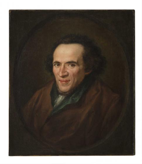Ölgemälde in vergoldetem Rahmen: Portät von Moses Mendelssohn im Halbprofil in einem gemalten ovalen Rahmen dargestellt, die Augen sind auf die Betrachtenden gerichtet. 