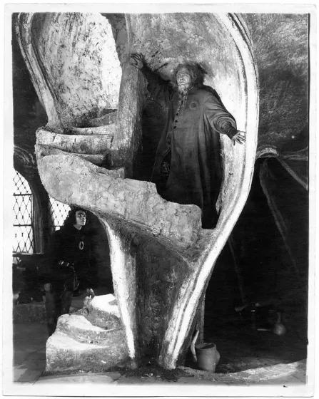 A bearded man on a spiral stair