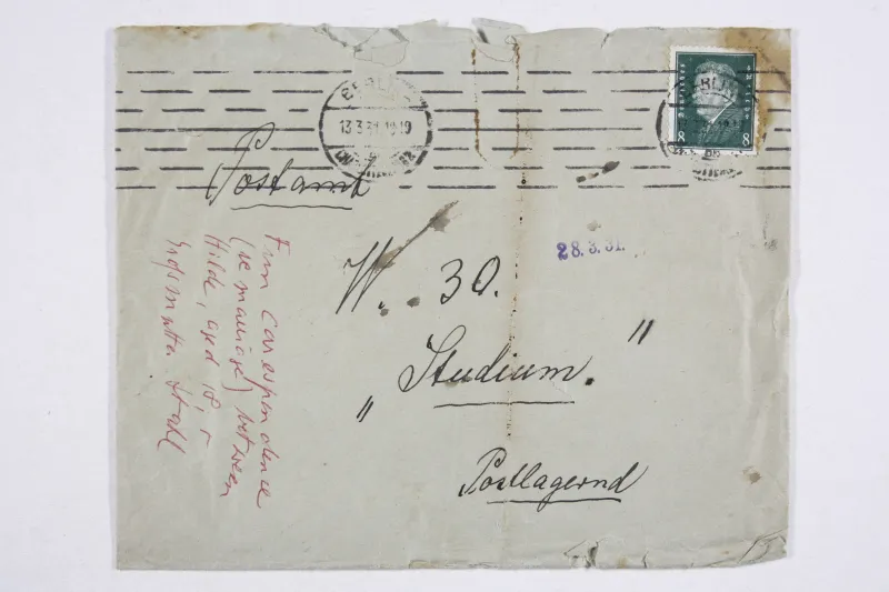 Old envelope. It is handwritten in black and red.