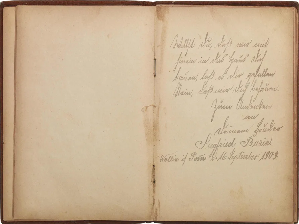 Open double-page with handwritten entry on the right side