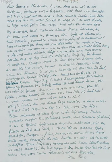 Blue ink on white sheet of paper.