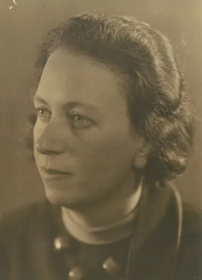  Sepia-colored portrait of a woman with chin-length hair.