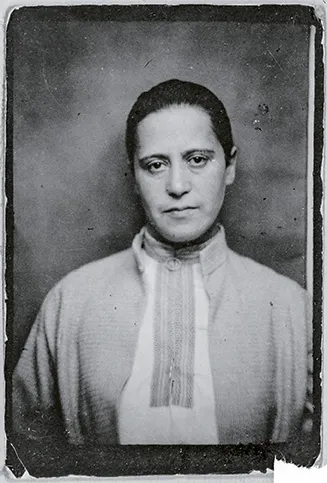  Black and white photograph of a woman wearing a tunic-like top.