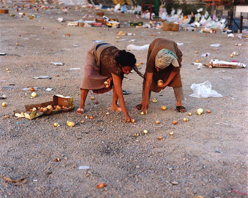 Artistic staging: The biblical Ruth and Naomi collecting left over onions in nowadays Tel-Aviv