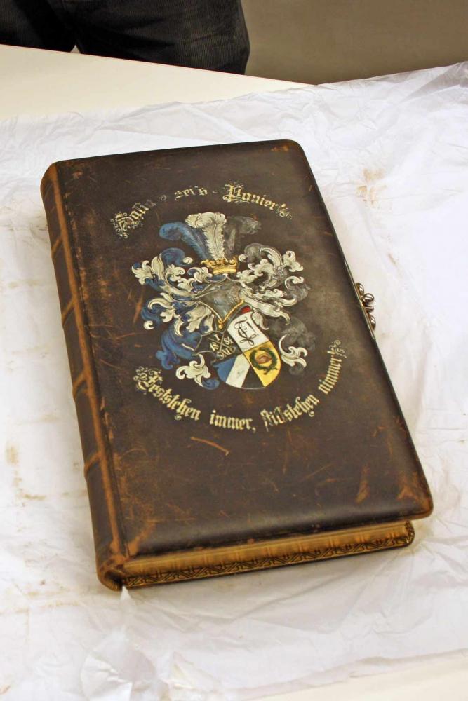 An old book with a richly decorated cover.