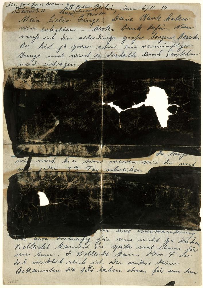Handwritten letter with blackened sections