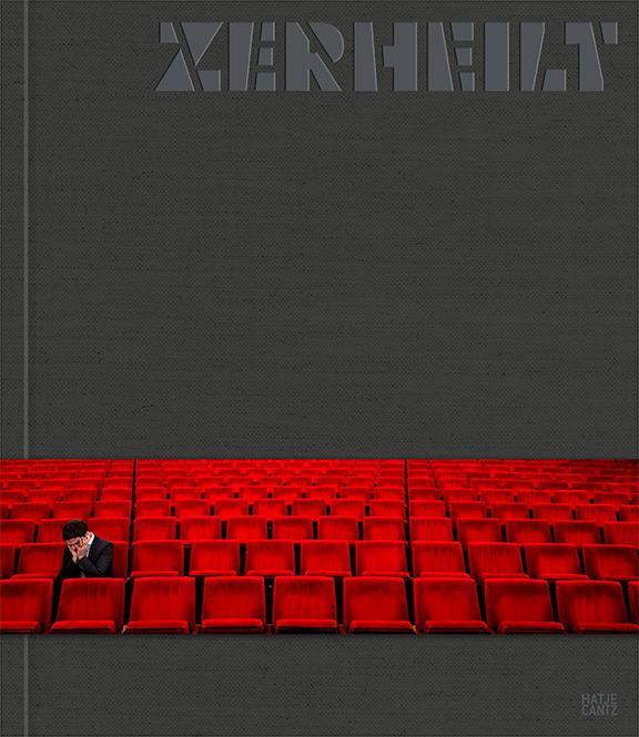 Gray book cover with the title ZERHEILT and a banderole with a photo of a person sitting alone in the red audience seats of a theater