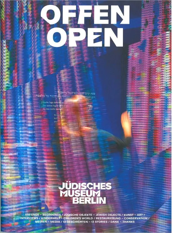 Colorful glitter curtain made of chains, and a blurred woman who is moving the curtain