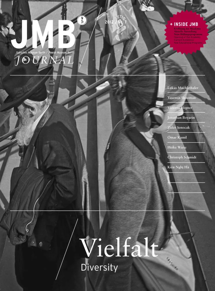 Cover of "Diversity", Journal Seven : black and white photograph of a woman and a man walking on stairs