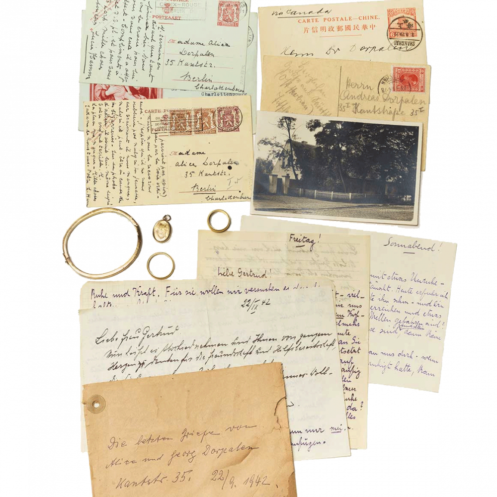 Bracelet, amulet, two rings, yellowed postcards and letters