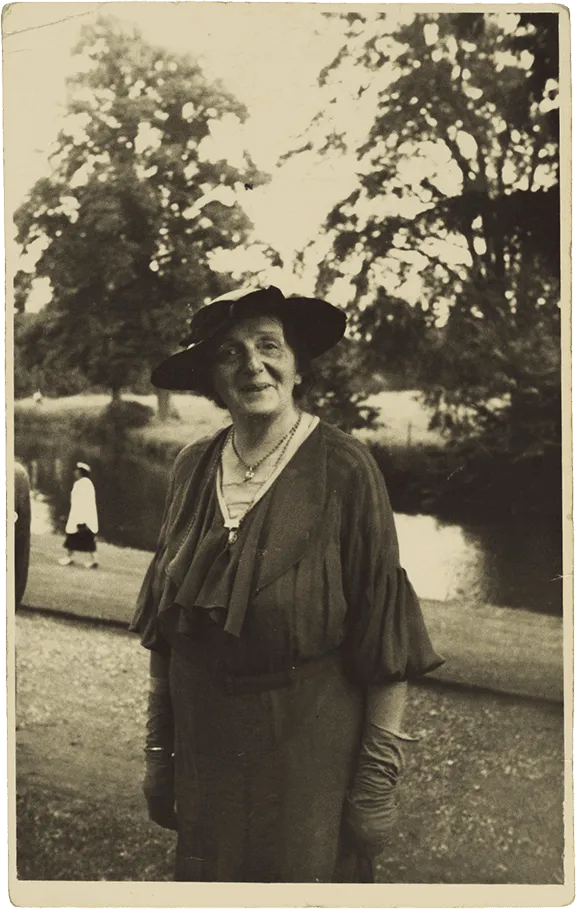 Historical black and white photograph of an elderly lady wearing a hat.