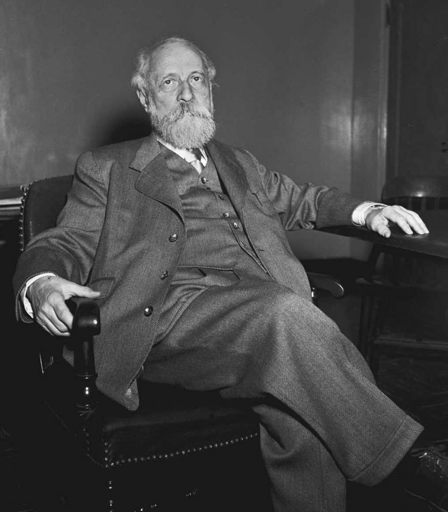 Black-and-white portrait of Martin Buber, sitting in an armchair