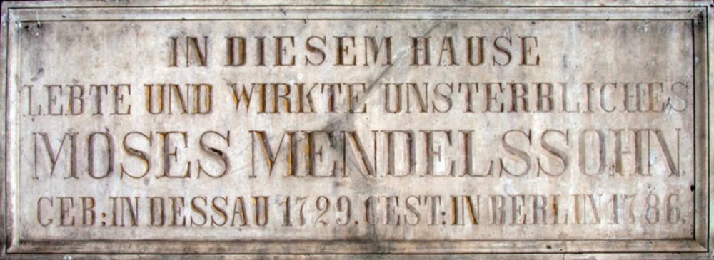 Marble plaque with a German caption translating to: “In this house lived and worked the immortal Moses Mendelssohn, b. in Dessau, 1729; d. in Berlin, 1786.”