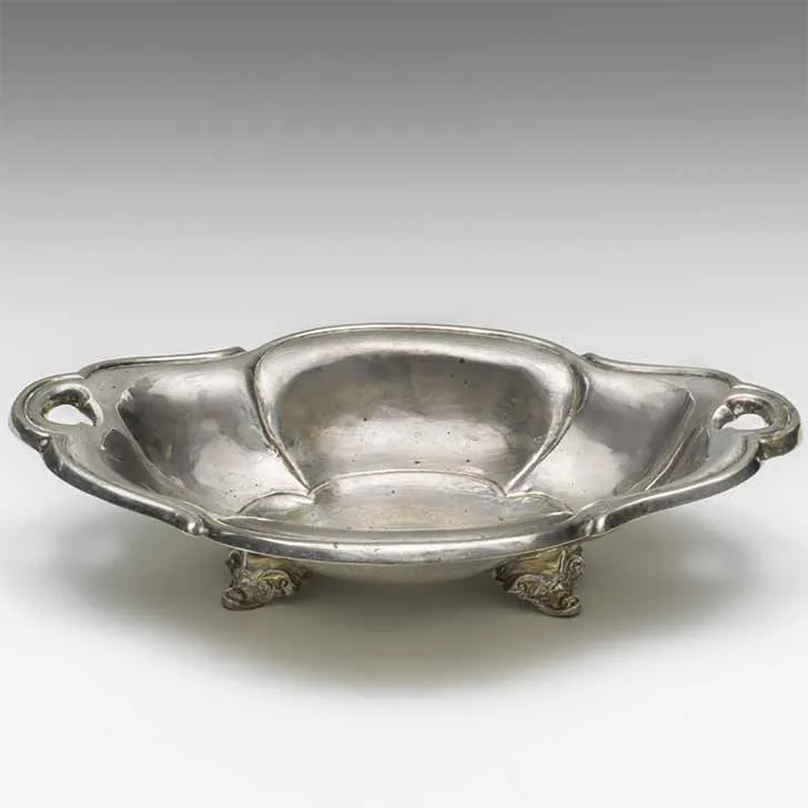 Bowl with two handles and feet, photographed diagonally from above