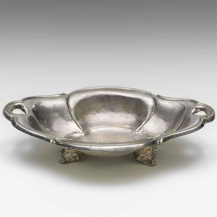 Bowl with two handles and feet, photographed diagonally from above