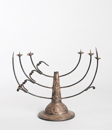 Damaged Hanukkah candlestick.