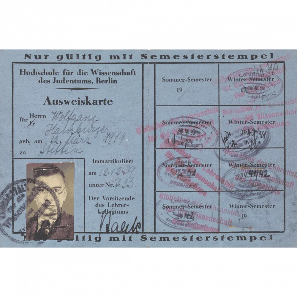Blue paper ID card with portrait photo, filled in by hand and stamped