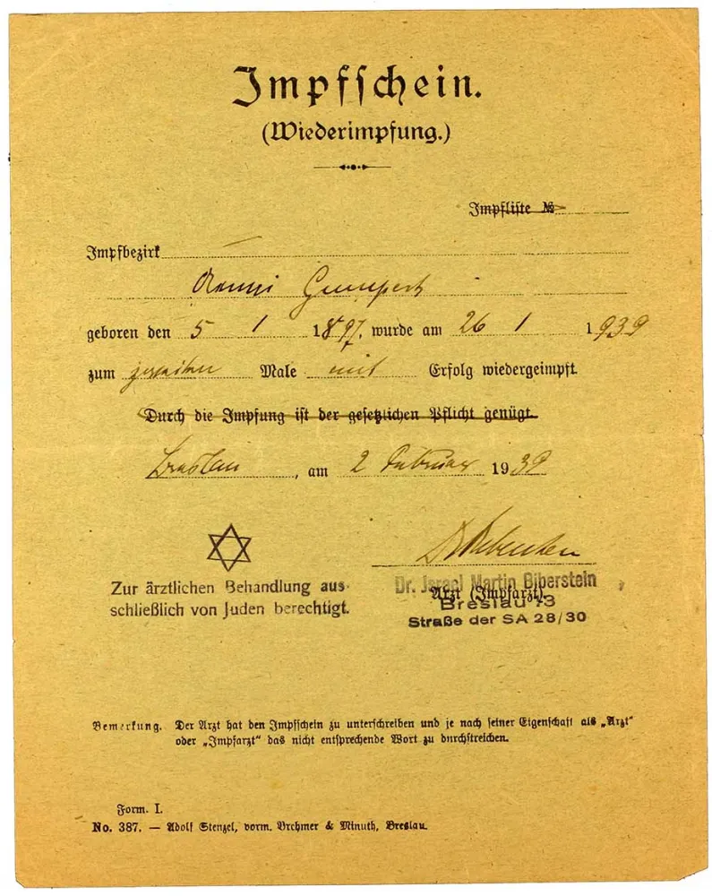 Vaccine certificate for Aenni Gumpert, printed form, filled out by hand, likewise with a government-imposed second name and a reference to the doctor’s treatment restrictions