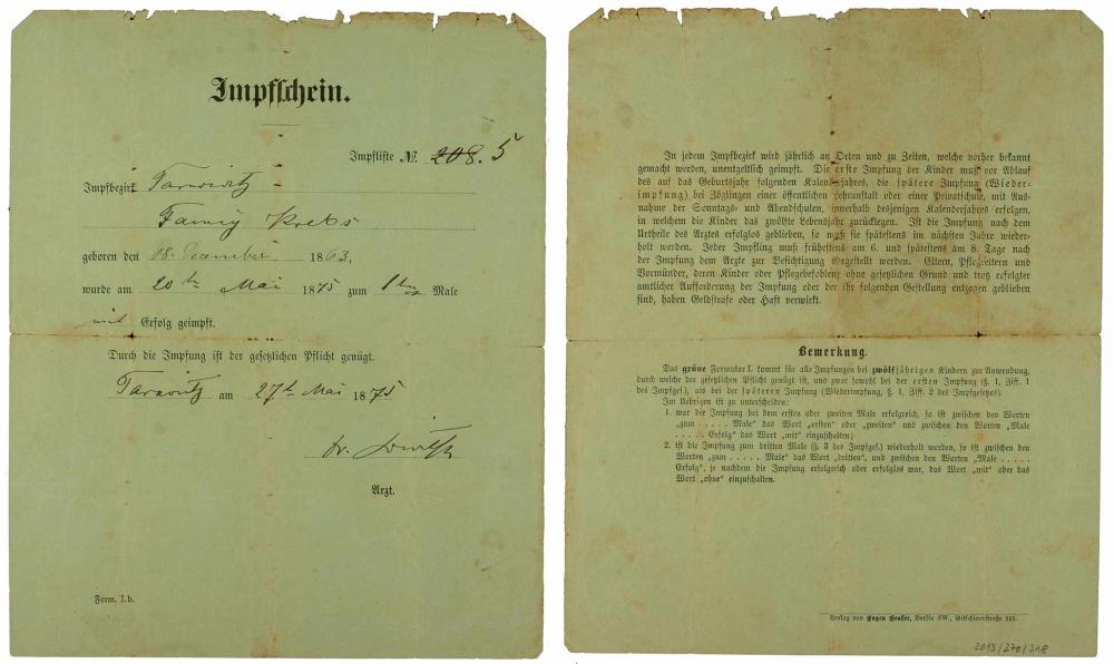 Front and back of the vaccine certificate for Fanny Krebs, smallpox vaccine, fillet out by hand, Tarnowitz, 20 May 1875.
