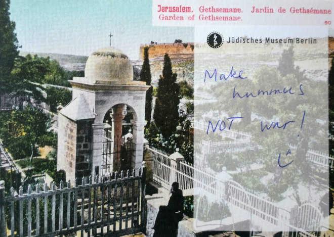 Postcard on which is written "Make hummus not war"