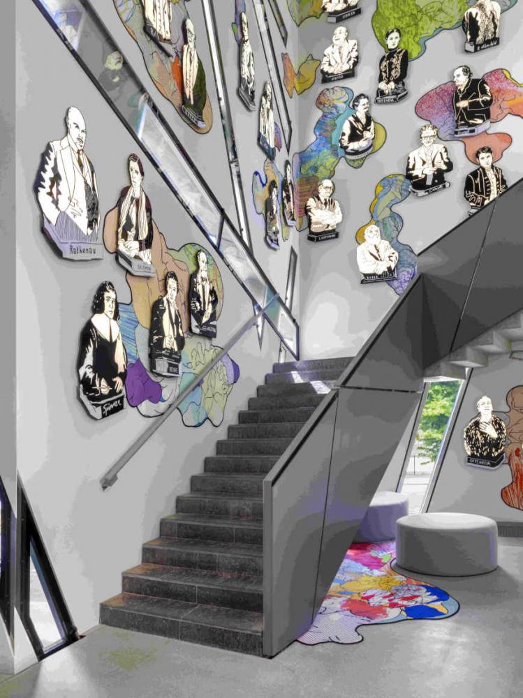 Stairs with illustrations of people on the wall