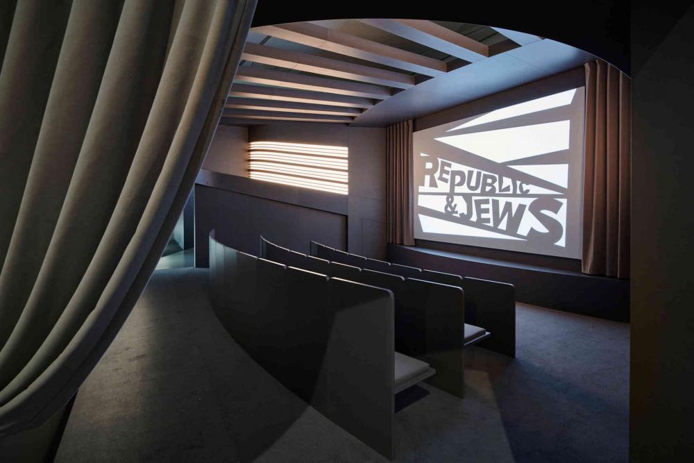 cinema hall with three rows, on the screen stands Republic & Jews
