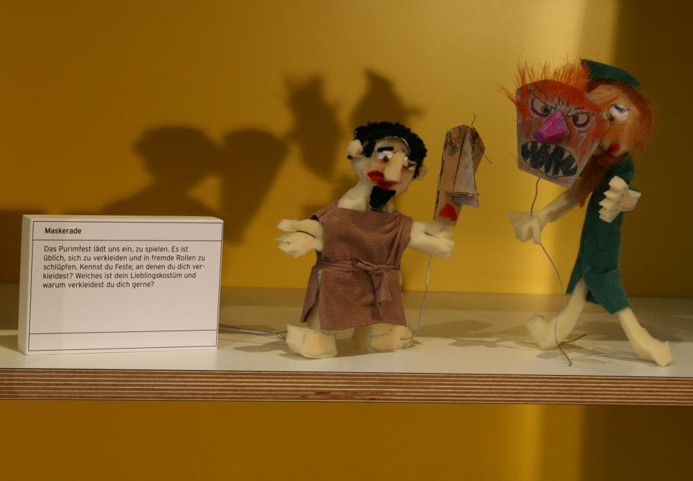 Cloth puppets wearing masks