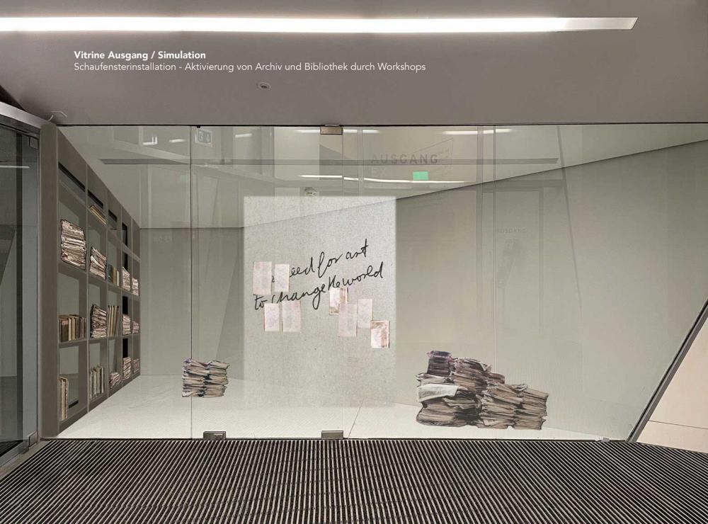 Floor-to-ceiling display case with two stacks of old files and several individual pages that seem to float in space.