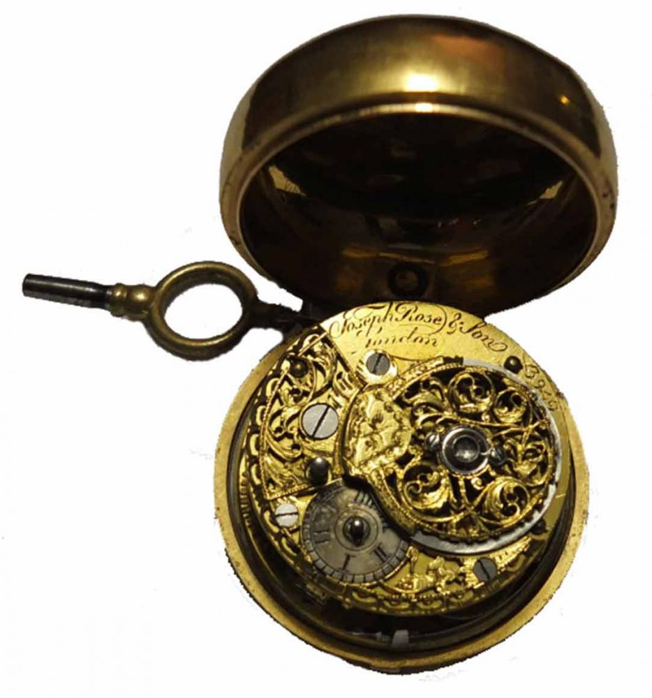 A gold pocket watch opened to reveal the clockwork inside