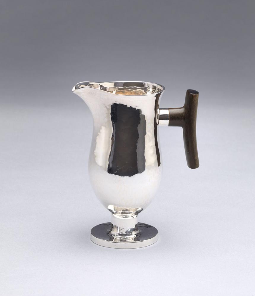 Silver creamer with horn handle